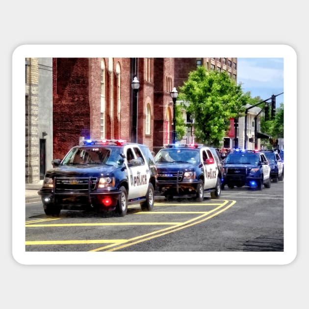 Line of Police Cars Sticker by SusanSavad